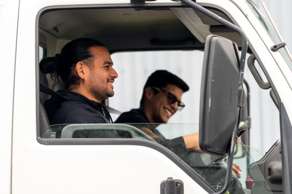 Friendly removalists driving a moving truck for house and office relocations in Victoria and Perth, Australia