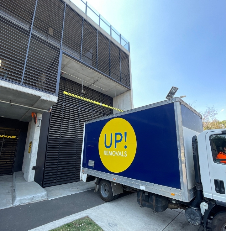 Moving truck parked outside a building for a commercial or apartment relocation in Australia